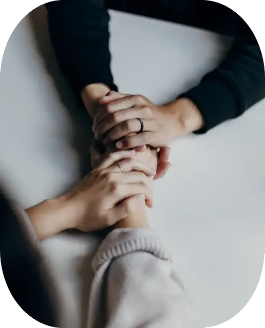 Hands holding each other in consolation