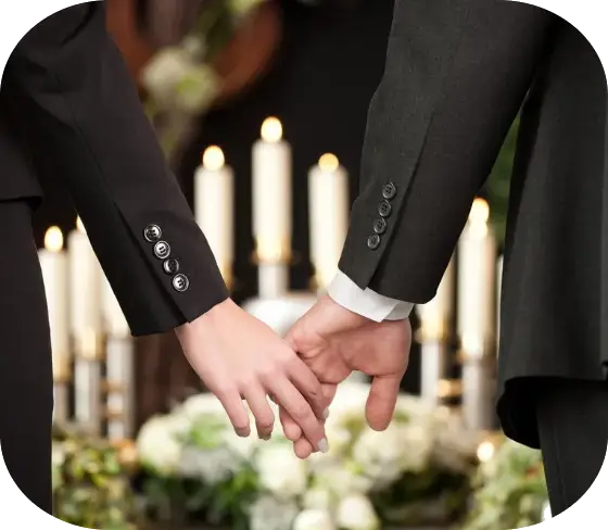 Hands holding at a funeral