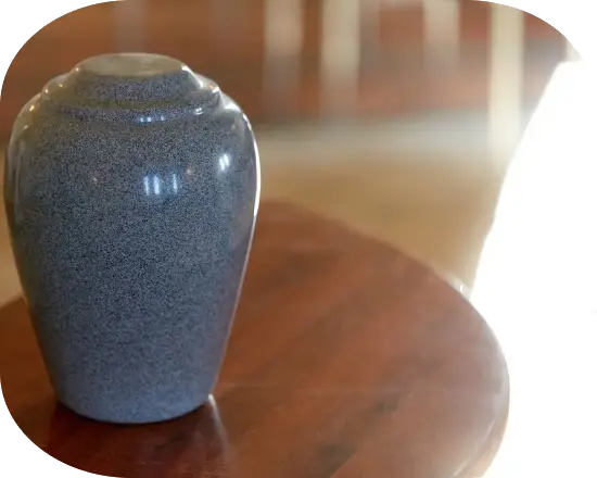 An urn on a wooden table